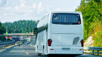 White Tourist bus in the road in Poland. Travel concept.