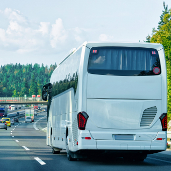 White Tourist bus in the road in Poland. Travel concept.